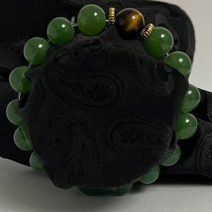 Beautiful green beaded bracelet with tiger eye.
